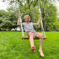 Load image into Gallery viewer, Child swinging on Hickory wood bench swing shown with white rope