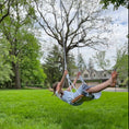 Load image into Gallery viewer, child using tree swing shown with hickory wood bench swing with white rope