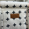 Load image into Gallery viewer, Close up of soft textured fabric in Oatmeal and black Swiss cross baby swing