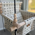 Load image into Gallery viewer, close up of natural wooden beads on black twisted rope option for swiss cross high back baby swing
