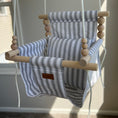 Load image into Gallery viewer, Wide ticking stripe baby swing shown with one pillow from front