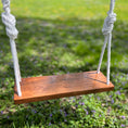 Load image into Gallery viewer, Walnut wood tree swing shown with white rope