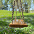 Load image into Gallery viewer, side view of brown natural rope on hickory wood bench swing