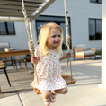Load image into Gallery viewer, child using hickory wood bench swing with brown natural rope on outdoor patio