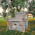 Load image into Gallery viewer, Premium outdoor baby swing, cool and comfortable for summer swinging shown in wheat with white braided rope installed on tree branch
