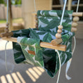 Load image into Gallery viewer, Tropical leaf baby swing with high back, perfect for outdoor spaces, shown with 1 pillow