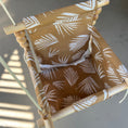 Load image into Gallery viewer, Detailed view of nutmeg leaf print on baby swing fabric