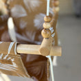 Load image into Gallery viewer, Close up of play beads on nutmeg leaf outdoor toddler swing pattern