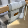 Load image into Gallery viewer, Close-up of soft cotton gray buffalo check fabric on baby swing