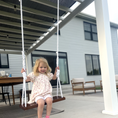 Load image into Gallery viewer, Child swinging on adult size walnut bench swing with white twisted rope