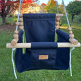 Load image into Gallery viewer, High back swing in navy fabric hanging in backyard