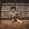 Load image into Gallery viewer, young child using sage green premium outdoor toddler swing installed on a swing set
