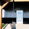 Load image into Gallery viewer, Wide Black striped outdoor baby swing shown with single point installation option using tree strap