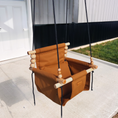 Load image into Gallery viewer, Side angle view of premium outdoor toddler swing in nutmeg color with twisted black ropes