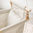 Load image into Gallery viewer, side view of greige and vanilla striped swing with one pillow and all natural untreated, non toxic wood beads and dowels