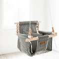 Load image into Gallery viewer, Side view of classic black and white stripe baby swing with non toxic wooden dowels