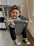 Load image into Gallery viewer, Baby using classic black and white stripe pattern high back swing, safe indoor design