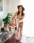 Load image into Gallery viewer, Mama pushing baby indoors using greige and vanilla stripe high back baby swing