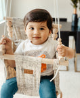 Load image into Gallery viewer, baby boy using the navigation pattern indoor baby swing hanging in living room