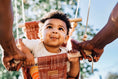 Load image into Gallery viewer, Baby using baby swing connecting with dad pushing him