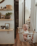 Load image into Gallery viewer, Baby using greige and vanilla high back swing, safe indoor design