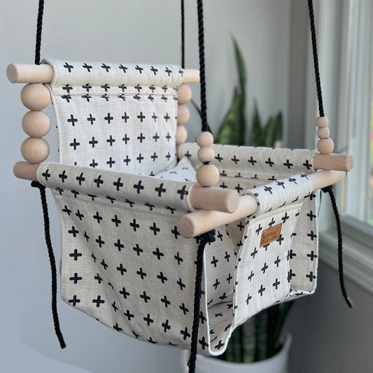 Oatmeal and black Swiss cross baby swing, modern indoor high back swing