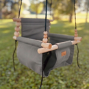 Premium outdoor baby and toddler swing in grassy shady back yard shown in color stone