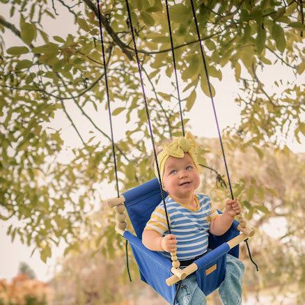 Royal Blue Outdoor Swing with child in motion