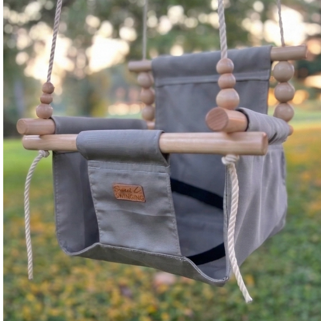 side angle of premium outdoor high back baby and toddler swing in stone